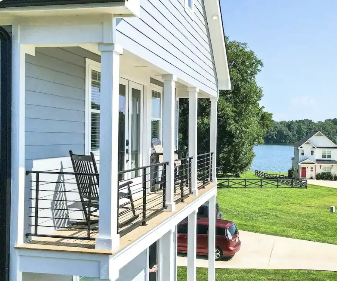 Porch seating overlooking a lake.